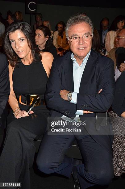 Christine Couland and Alain Afflelou attend the Stephane Rolland: Front Row - Paris Fashion Week Haute-Couture F/W 2013-2014 at the Tennis Club de...