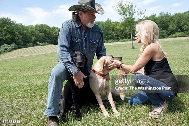 Ted and his wife Shemane Nugent play with the dogs and go for a walk on their 1,200 acre ranch in Concord, Michigan on June 6, 2013. Ted said when he...