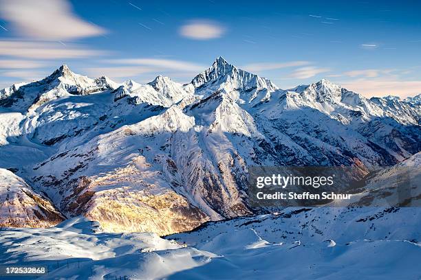 cool night - swiss alps fotografías e imágenes de stock