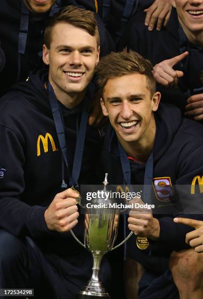 Matt Scharenberg and Luke Dunstan of South Australia pose with the trophy after the AFL Under 18s Championship match between South Australia and...