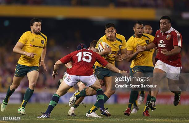 Israel Folau of the Wallabies is tackled during game two of the International Test Series between the Australian Wallabies and the British & Irish...