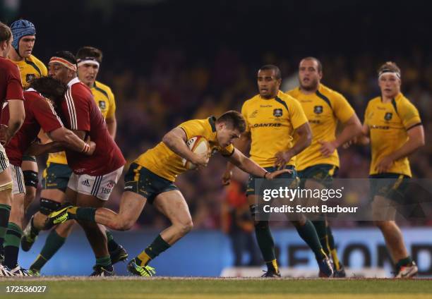 James O'Connor of the Wallabies is tackled during game two of the International Test Series between the Australian Wallabies and the British & Irish...