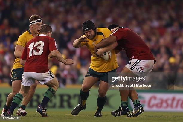 Benn Robinson of the Wallabies is tackled during game two of the International Test Series between the Australian Wallabies and the British & Irish...