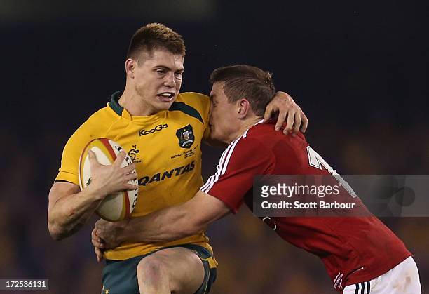 James O'Connor of the Wallabies is tackled by Brian O'Driscoll of the Lions during game two of the International Test Series between the Australian...