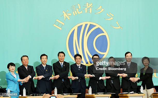 Leaders of Japan's political parties pose for a group photograph ahead of a debate at the Japan National Press Club in Tokyo, Japan, on Wednesday,...