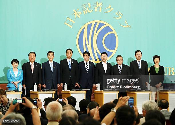 Leaders of Japan's political parties pose for a group photograph ahead of a debate at the Japan National Press Club in Tokyo, Japan, on Wednesday,...