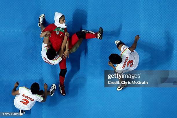 Jafarikalokan Sedigheh of Iran is caught by Priyanka Priyanka of Independent Olympic Athletes during the Women's Kabaddi Gold Medal match at Ansan...