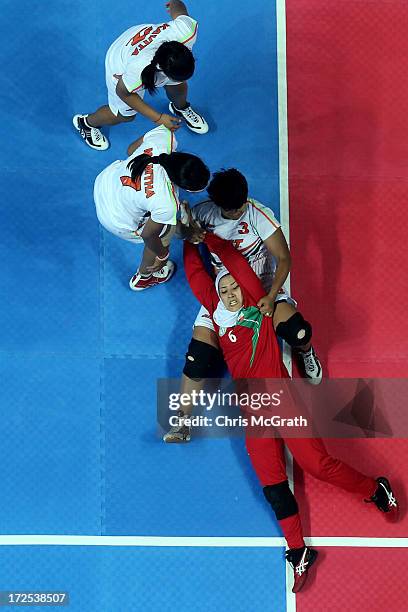 Ilat Sahar of Iran is caught by Joseph Deepika Henry of Independent Olympic Athletes during the Women's Kabaddi Gold Medal match at Ansan Sangnoksu...