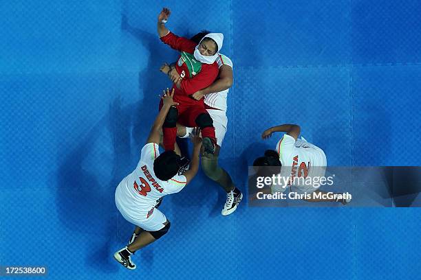 Jafarikalokan Sedigheh of Iran is caught by Joseph Deepika Henry of Independent Olympic Athletes during the Women's Kabaddi Gold Medal match at Ansan...