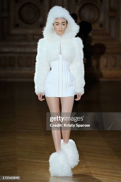 Model walks the runway during the Serkan Cura Couture show as part of Paris Fashion Week Haute-Couture Fall/Winter 2013-2014 at Mairie du 4e on July...