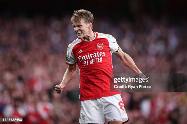 Martin Odegaard of Arsenal celebrates during the Premier League match between Arsenal FC and Manchester City at Emirates Stadium on October 08, 2023...