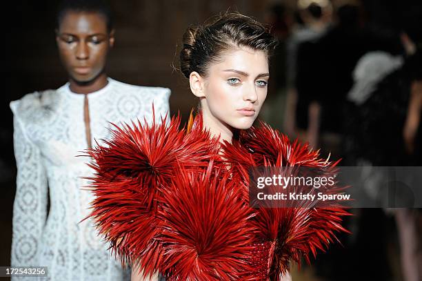 Models walk the runway during the Serkan Cura Couture show as part of Paris Fashion Week Haute-Couture Fall/Winter 2013-2014 at Mairie du 4e on July...