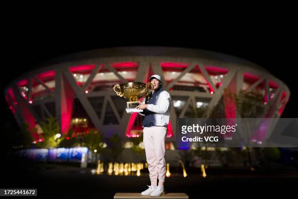 Winner Iga Swiatek of Poland poses with the Champion Trophy during a photocall after the Women's Singles Final match on day 13 of 2023 China Open at...