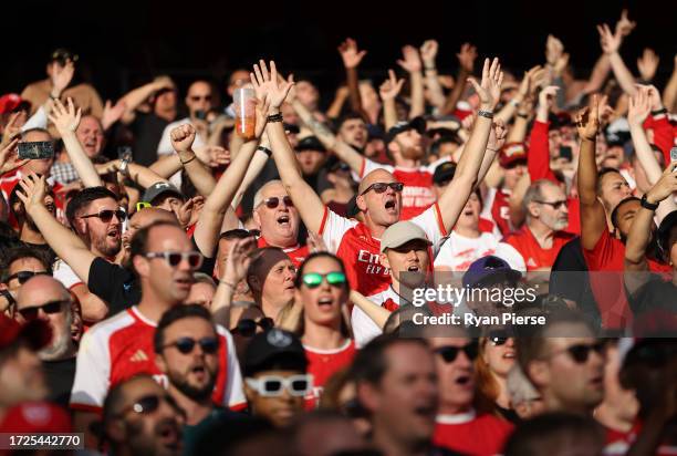 Arsenal fans cheer during the Premier League match between Arsenal FC and Manchester City at Emirates Stadium on October 08, 2023 in London, England.