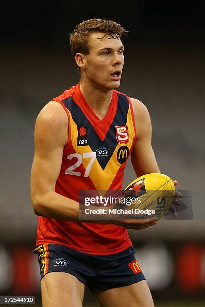 Matt Scharenberg of South Australia looks ahead with the ball during the AFL Under 18s Championship match between South Australia and Western...
