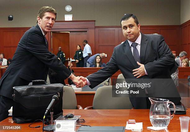 Defense attorney Mark O'Mara, left, and George Zimmerman shake hands at the start of day 18 of Zimmerman's trial in Seminole circuit court, July 3,...