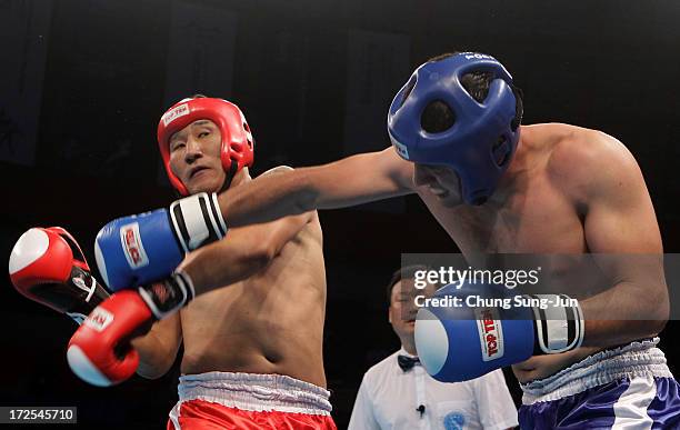 Burenzorig Batmunkh of Mongolia competes with Allamurad Annamuradov of Turkmenistan in the Kickboxing, Full Contact Men's 81kg Round of 16 at Dowon...