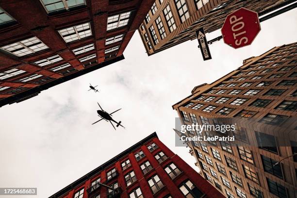 police flying with helicopters over brooklyn, new york - brooklyn helicopter stock pictures, royalty-free photos & images