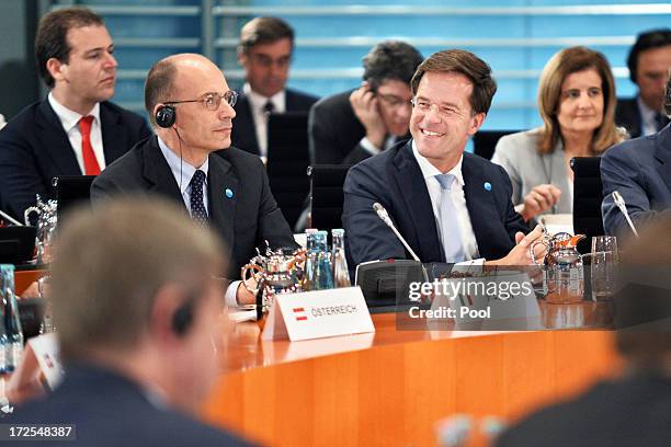 Italian Prime Minister Enrico Letta and Dutch Prime Minister Mark Rutte attend a summit of several European leaders to address European youth...