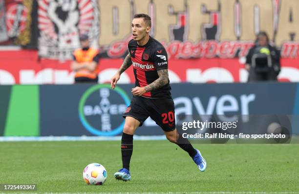 Alex Grimaldo of Bayer 04 Leverkusen plays the ball during the Bundesliga match between Bayer 04 Leverkusen and 1. FC Köln at BayArena on October 8,...