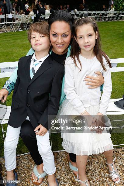 Hermine de Clermont-Tonnerre and her children Allegra and Calixte attend the Frank Sorbier show as part of Paris Fashion Week Haute-Couture...