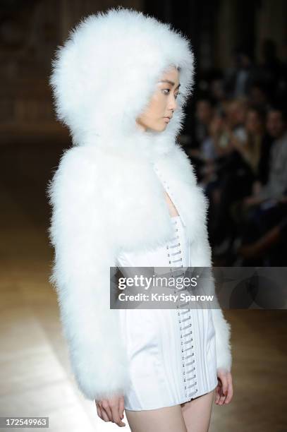 Model walks the runway during the Serkan Cura Couture show as part of Paris Fashion Week Haute-Couture Fall/Winter 2013-2014 at Mairie du 4e on July...