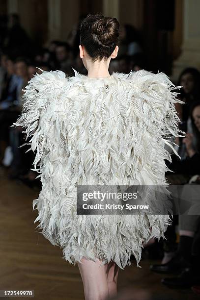 Model walks the runway during the Serkan Cura Couture show as part of Paris Fashion Week Haute-Couture Fall/Winter 2013-2014 at Mairie du 4e on July...