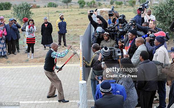 Convoy arrives at Mandla Mandela's home on July 3 in Mvezo, South Africa. The sheriff gained entry by breaking the padlock of the gates into Mandla...