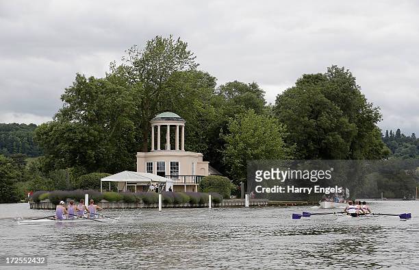 View of Temple Island as crews from Durham University and the University of London race down the straight during the Henley Royal Regatta on July 3,...