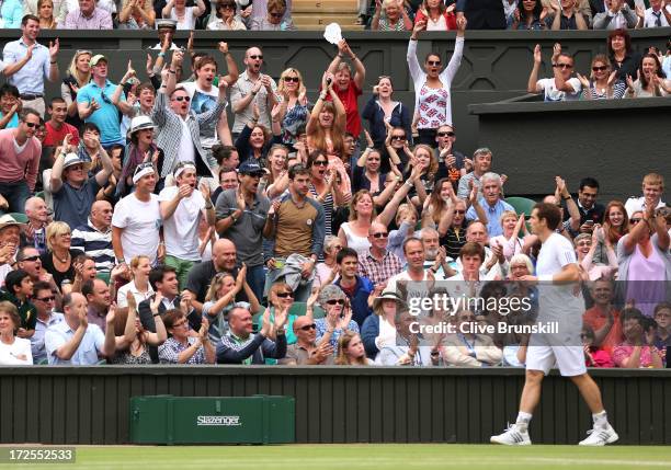 Fans show their support for Andy Murray of Great Britain during his Gentlemen's Singles quarter-final match against Fernando Verdasco of Spain on day...