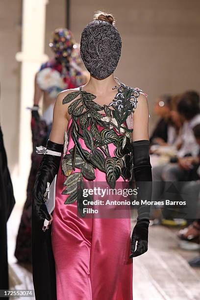 Model walks the runway during the Maison Martin Margiela show as part of Paris Fashion Week Haute-Couture Fall/Winter 2013-2014 at on July 3, 2013 in...