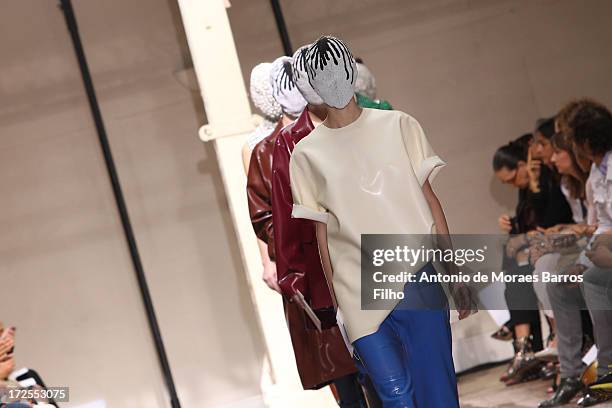 Models walk the runway during the Maison Martin Margiela show as part of Paris Fashion Week Haute-Couture Fall/Winter 2013-2014 at on July 3, 2013 in...