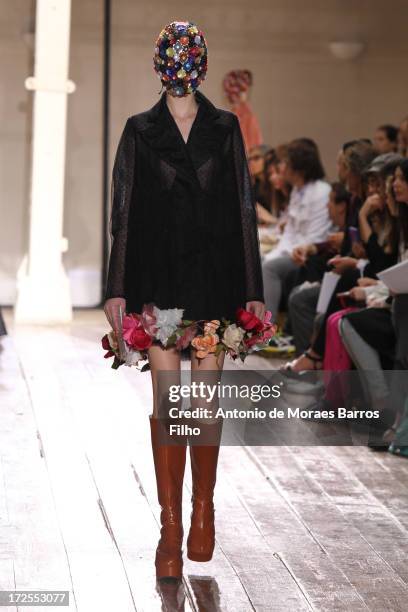 Model walks the runway during the Maison Martin Margiela show as part of Paris Fashion Week Haute-Couture Fall/Winter 2013-2014 at on July 3, 2013 in...