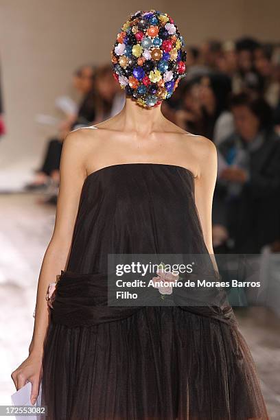 Model walks the runway during the Maison Martin Margiela show as part of Paris Fashion Week Haute-Couture Fall/Winter 2013-2014 at on July 3, 2013 in...