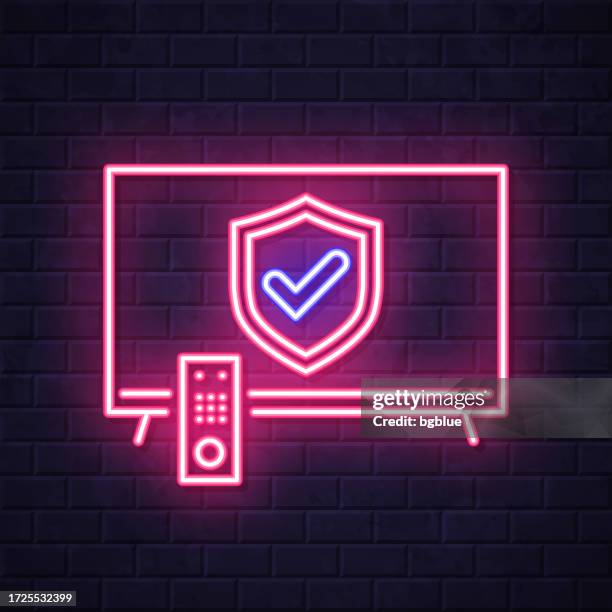 secure tv. glowing neon icon on brick wall background - remote support stock illustrations