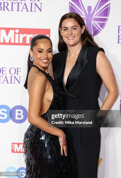 Amber Gill and Jen Beattie arrive at the Pride Of Britain Awards 2023 at Grosvenor House on October 08, 2023 in London, England.