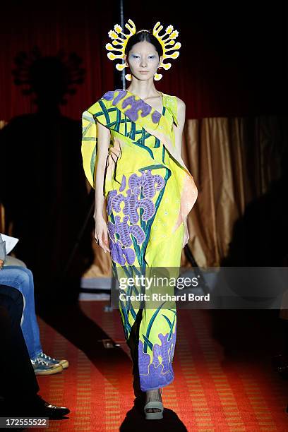 Model walks the runway during the Yoshiki Hishinuma Couture show as part of Paris Fashion Week Haute-Couture Fall/Winter 2013-2014 at Hotel Lutetia...