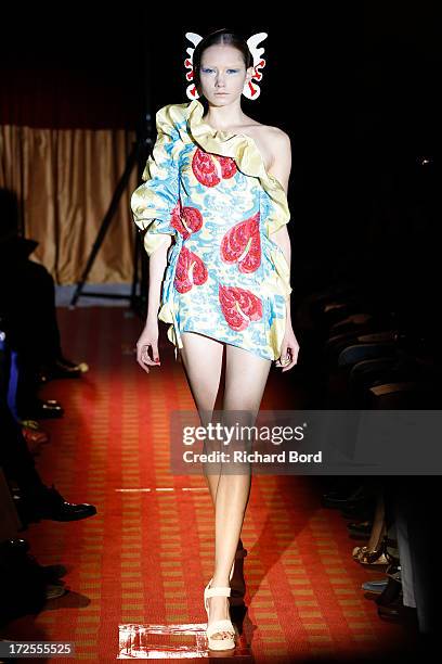 Model walks the runway during the Yoshiki Hishinuma Couture show as part of Paris Fashion Week Haute-Couture Fall/Winter 2013-2014 at Hotel Lutetia...