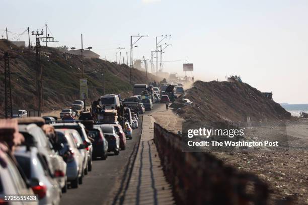 Displaced Palestinian families from the northern and central Gaza Strip evacuate toward southern Gaza on Friday, Oct. 13, 2023.