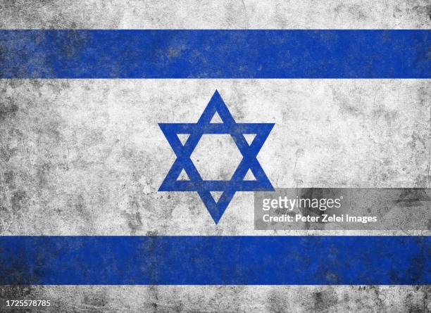 israel flag on damaged textured wall background - israeli flag stockfoto's en -beelden