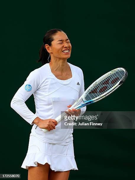 Kimiko Date-Krumm of Japan reacts next to her team-mate David Marrero of Spain during a break in their Mixed Doubles third round match against...
