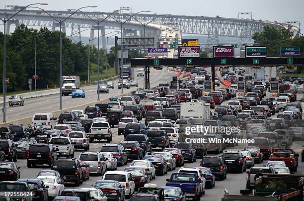 Vehicles wait to cross the Chesapeake Bay Bridge on U.S. Routes 50 and 301 July 3, 2013 near Sandy Point State Park in Arnold, Maryland. The...