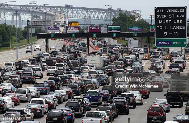 Vehicles wait to cross the Chesapeake Bay Bridge on U.S. Routes 50 and 301 July 3, 2013 near Sandy Point State Park in Arnold, Maryland. The...