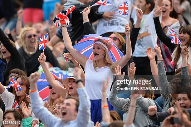 Tennis fans on Murray Mount cheer at the moment Britain's Andy Murray beats Spain's Fernando Verdasco during their men's singles quarter-final match...
