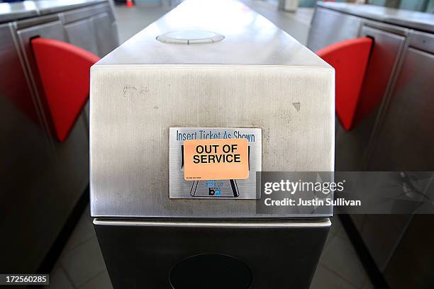 An out of service sign is posted on a pay gate at the Bay Area Rapid Transit Millbrae station on July 3, 2013 in Millbrae, California. For a third...