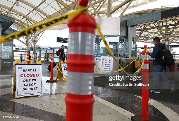 Closure signs are posted at the Bay Area Rapid Transit Millbrae station on July 3, 2013 in Millbrae, California. For a third day, hundreds of...