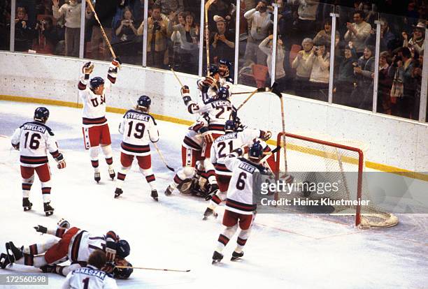 Winter Olympics: Overall view of Team USA players victorious on ice after winning Medal Round game vs USSR at Olympic Fieldhouse in the Olympic...