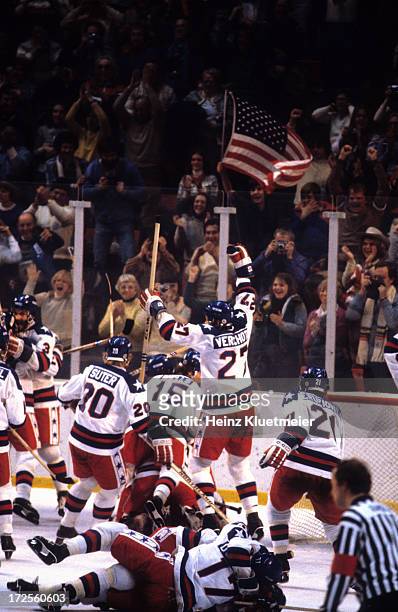 Winter Olympics: Overall view of Team USA Bob Suter , Mark Wells , and Phil Verchota victorious on ice after winning Medal Round game vs USSR at...