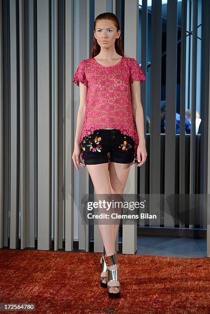 Model poses on the runway at Simone Anes & Stephan Pelger Show during Mercedes-Benz Fashion Week Spring/Summer 2014 on July 3, 2013 in Berlin,...