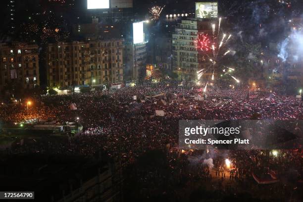Fireworks and shouts of joy emanate from Tahrir Square after a broadcast by the head of the Egyptian military confirming that they will temporarily...